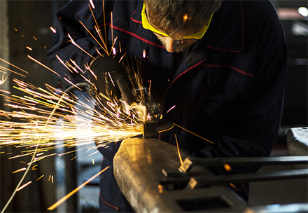 welder working on forklift